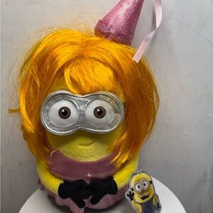 Yellow Plush Toy with Orange Hair and Pink Outfit